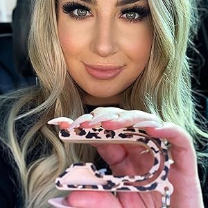 Mom Holding Leopard Car Seat Key