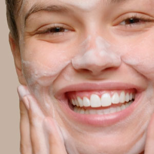 Foaming Acne Wash being applied to face