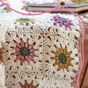 A colorful floral blanket made with soft self-striping yarn.