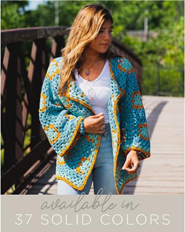 A woman outside in a blue-and-orange knit sweater. Text reads: Available in 37 solid yarn colors.