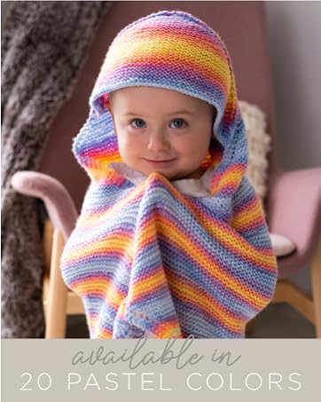 A baby wearing a yellow-and-purple shawl with stripes and a hood.