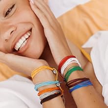 girl smiling wearing bracelets