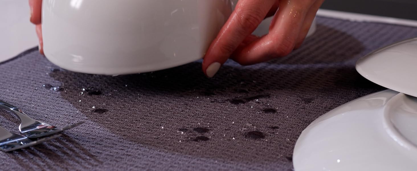 Water drips on dish drying mat